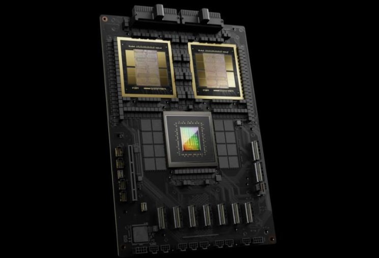 Top-down view of a dark GPU module with two large processor dies and surrounding memory.